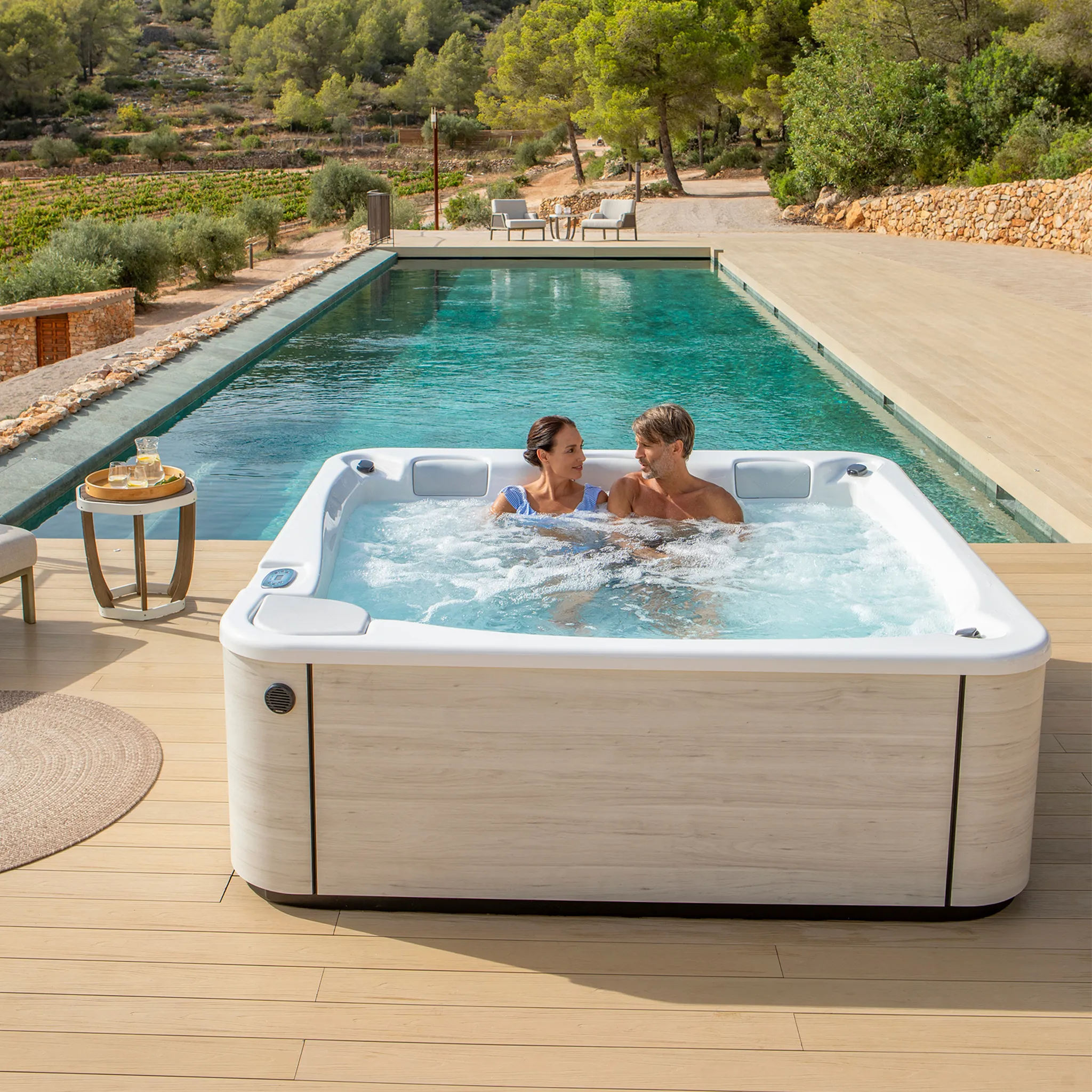 outdoor spa with a couple relaxing in the outdoor jacuzzi